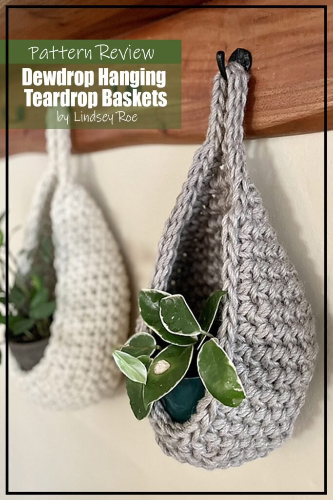 Dewdrop Hanging Teardrop Baskets crochet pattern samples made from jute yarn and hung on a wooden board from black hangers. Each basket has a plant in it. The text on the image reads "Dewdrop Hanging Teardrop Baskets by Lindsey Roe Pattern Review"