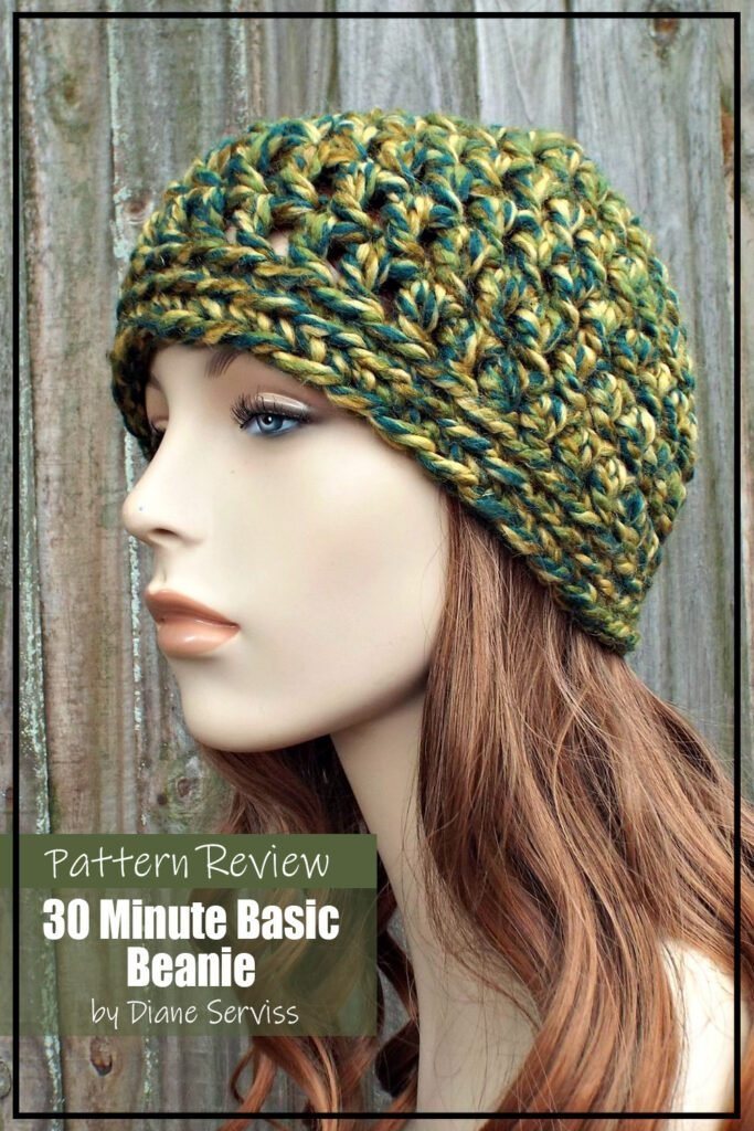 30 Minute Basic Beanie crochet hat pattern sample made using a green and blue super bulky yarn. The hat is modeled on a mannequin. The text on the image reads "30 Minute Basic Beanie by Diane Serviss Pattern Review'.