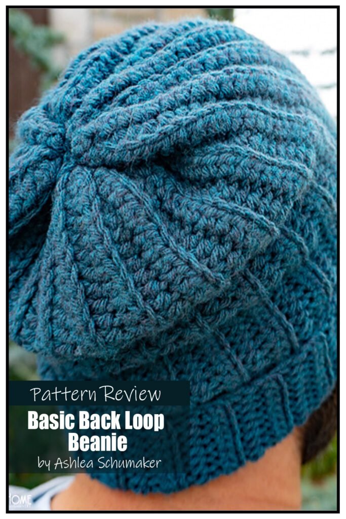 Basic Back Loop Beanie crochet hat pattern sample is made using a teal heavy worsted weight (aran weight) yarn. The texture on the hat is made by crocheting in the back loop. The hat is modeled by a man with a beard. The image shows the back and crown of the hat. Text on the image reads "Basic Back Loop Beanie by Ashlea Schumaker Pattern Review".
