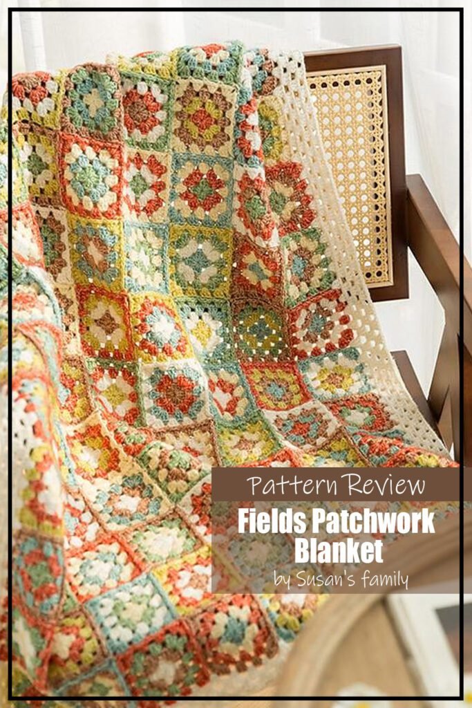 Blanket crochet pattern sample is made using a beautiful collection of muted yet colourful yarns. Blue, green, brick red, and brown is anchored with a cream. The blanket is draped over a chair. The text on the image reads "Fields Patchwork Blanket by Susan's Family Pattern Review".